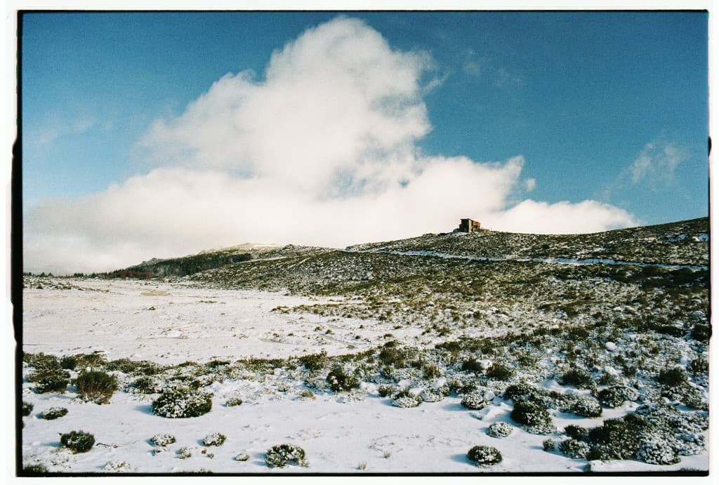 Snow-covered landscape representing reliability and steady managed service delivery